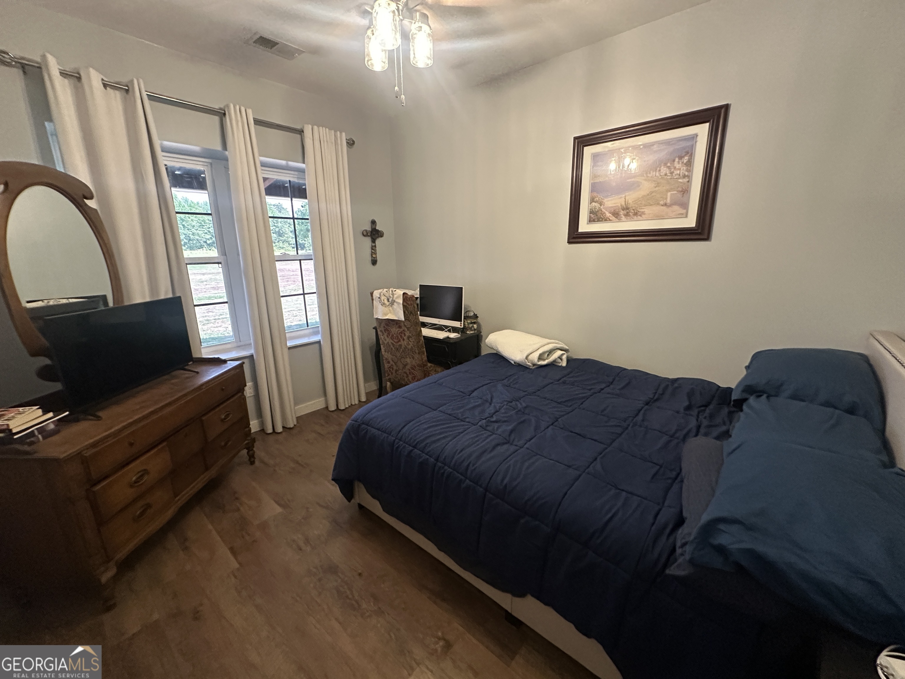 925 Cleary Road Brooklet, GA 30415 - Photo 15 of 48 a bedroom with bed and window