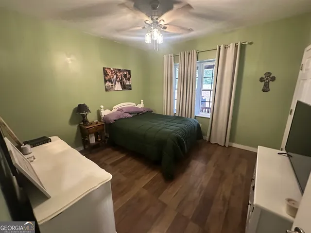 a bed room with a bed and a chandelier