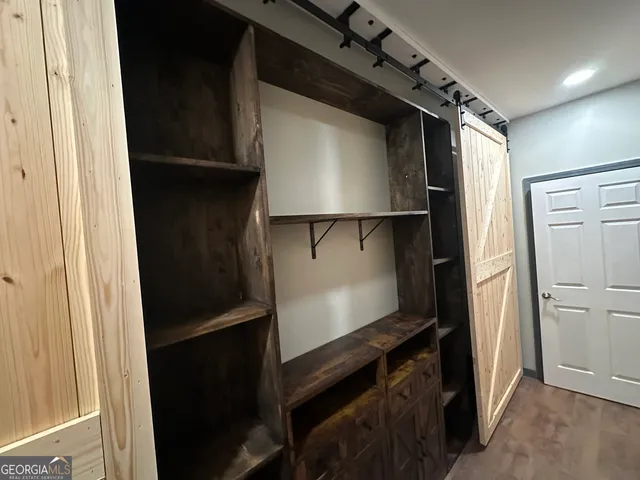 a kitchen with a refrigerator and a stove