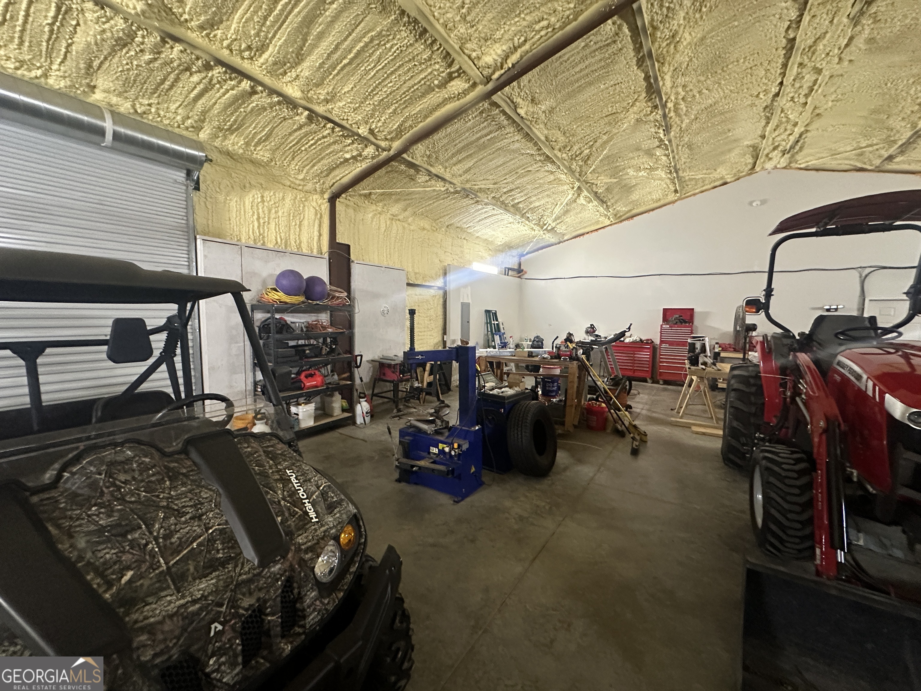 925 Cleary Road Brooklet, GA 30415 - Photo 27 of 48 a view of a garage with a bike and car