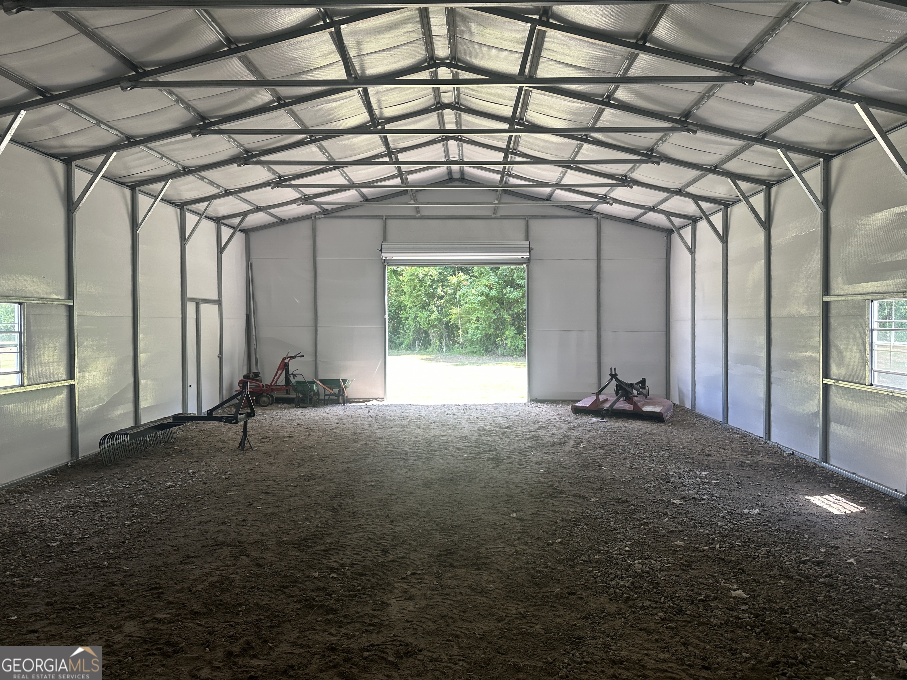925 Cleary Road Brooklet, GA 30415 - Photo 30 of 48 a big room with windows and ceiling fan