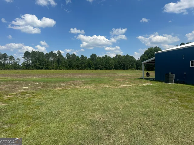 a view of a lake with a yard