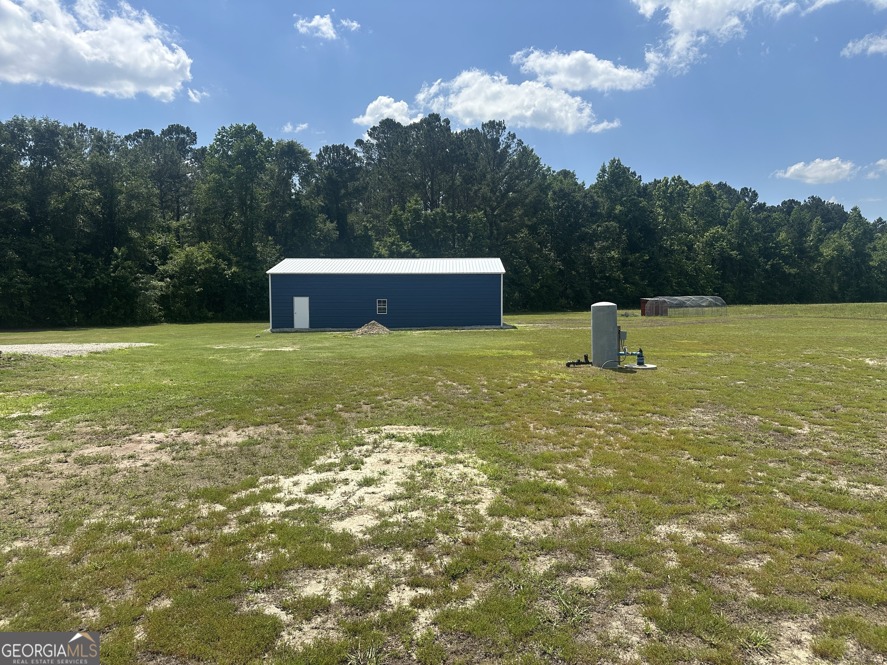 925 Cleary Road Brooklet, GA 30415 - Photo 36 of 48 a view of a lake with a yard