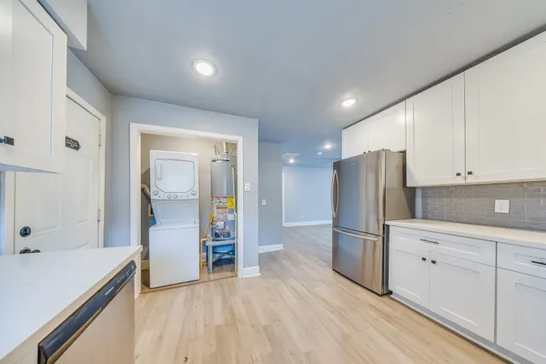 a kitchen with stainless steel appliances a refrigerator and a sink