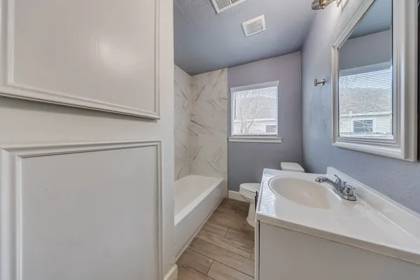 a bathroom with a sink and a bathtub