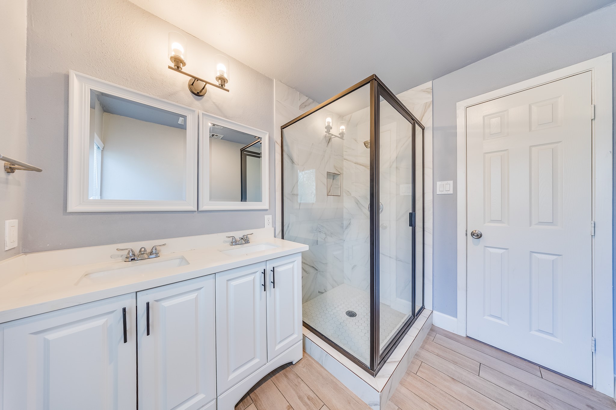 4523 Keystone Street Houston, TX 77021 - Photo 4 of 24 a bathroom with a double vanity sink mirror and shower