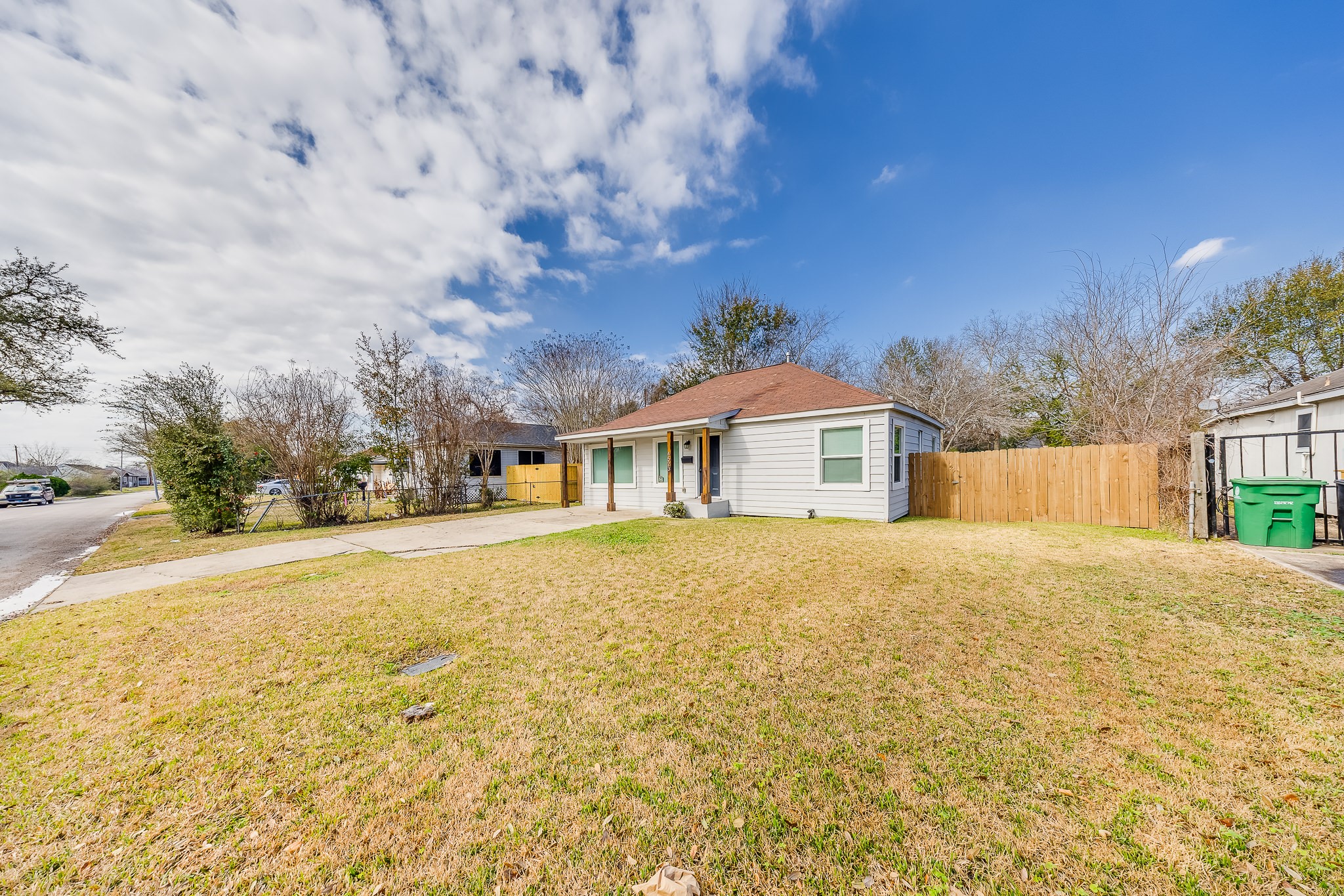 4523 Keystone Street Houston, TX 77021 - Photo 7 of 24 a front view of house with yard and trees in the background