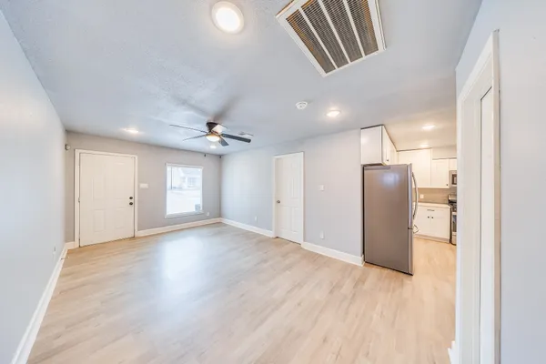 a view of an empty room with a window