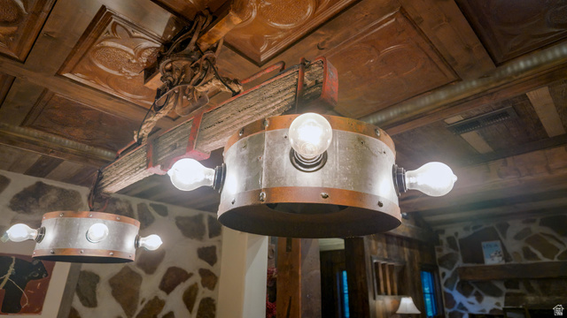 2983 East Ridgetop Road, Unit 27 Provo, UT 84604 - Photo 18 of 63 Elegant ceiling fixture featuring brushed metal drum shade with integrated globe lights and ornamental wooden beam detail