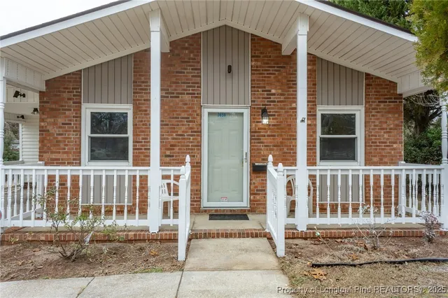 a front view of a house with a fence