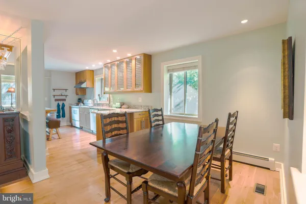 a dining room with furniture and window