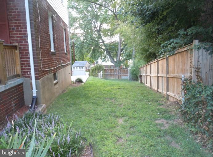5842 Monticello Road Alexandria, VA 22303 - Photo 22 of 26 a view of backyard with garden and trees