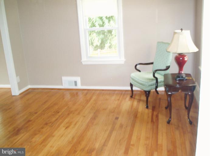 5842 Monticello Road Alexandria, VA 22303 - Photo 6 of 26 a living room with furniture and a window