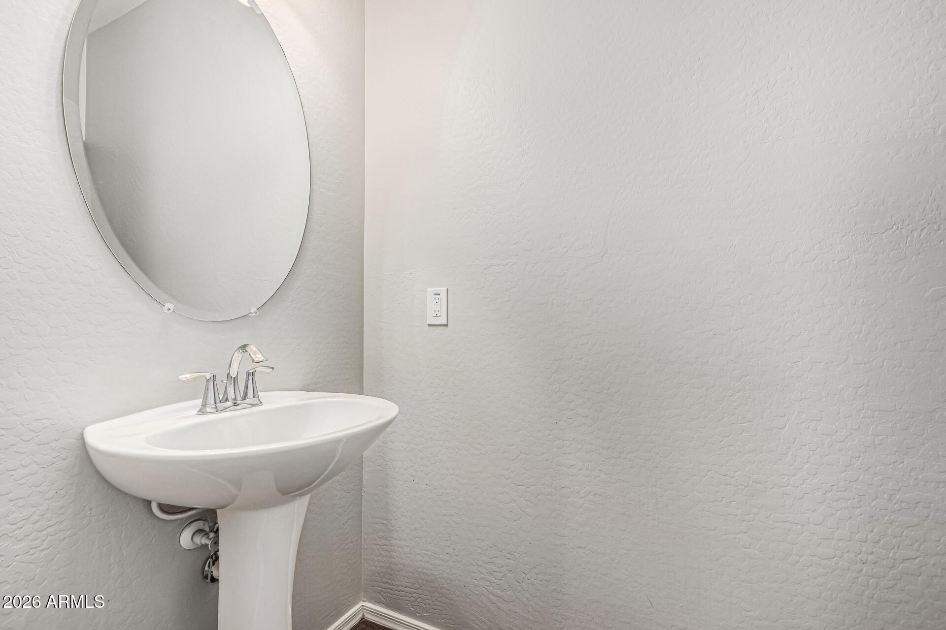 2381 East Brigadier Drive Gilbert, AZ 85298 - Photo 15 of 36 a bathroom with a sink and a mirror