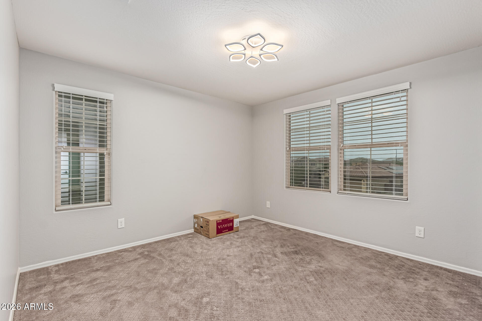 2381 East Brigadier Drive Gilbert, AZ 85298 - Photo 21 of 36 a view of an empty room with a window