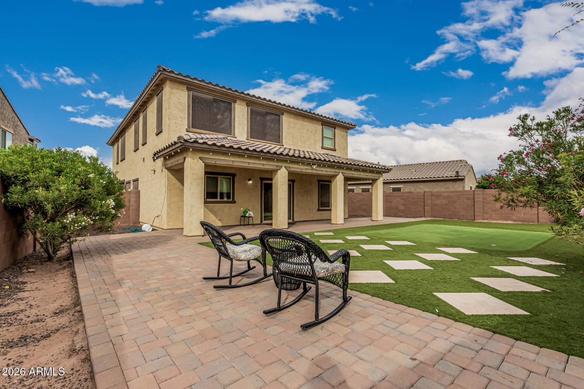 2381 East Brigadier Drive Gilbert, AZ 85298 - Photo 34 of 36 a view of a house with backyard porch and sitting area