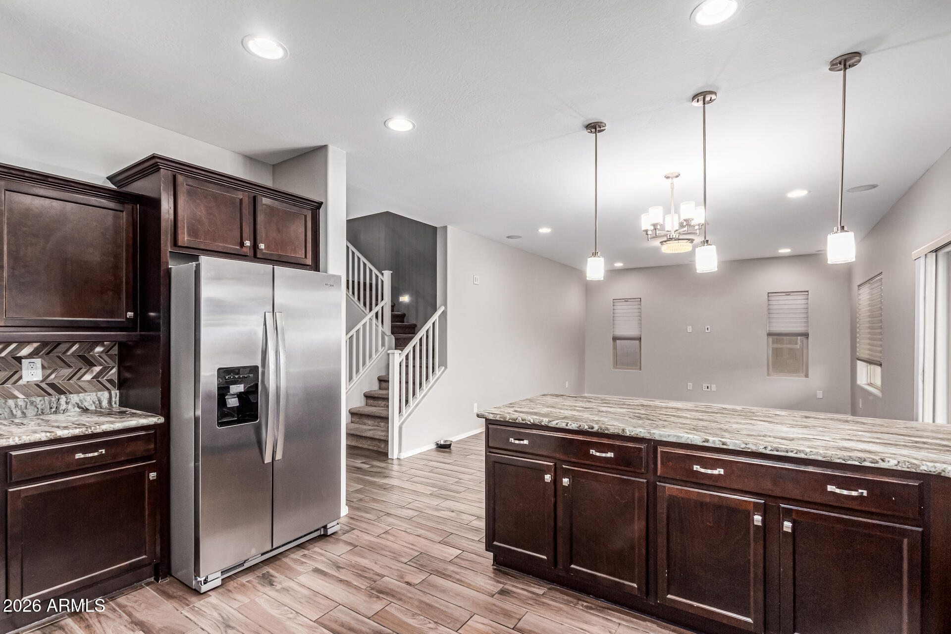 2381 East Brigadier Drive Gilbert, AZ 85298 - Photo 7 of 36 a kitchen with stainless steel appliances granite countertop a refrigerator a sink and a granite counter tops