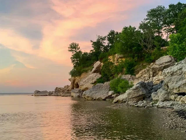 a view of swimming pool with a yard and lake view