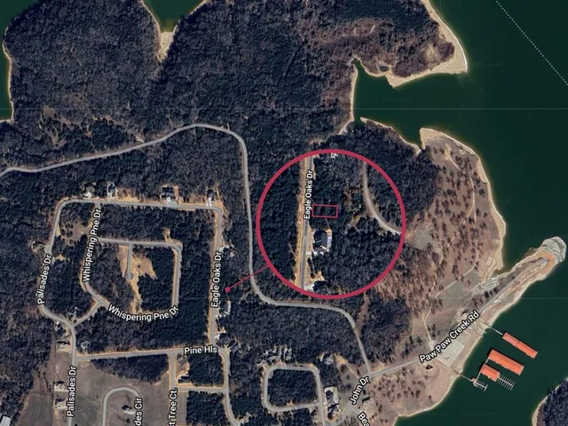 an aerial view of houses with outdoor space and lake view