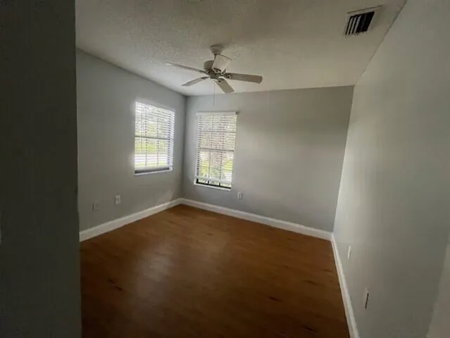 a bathroom with a shower sink and mirror