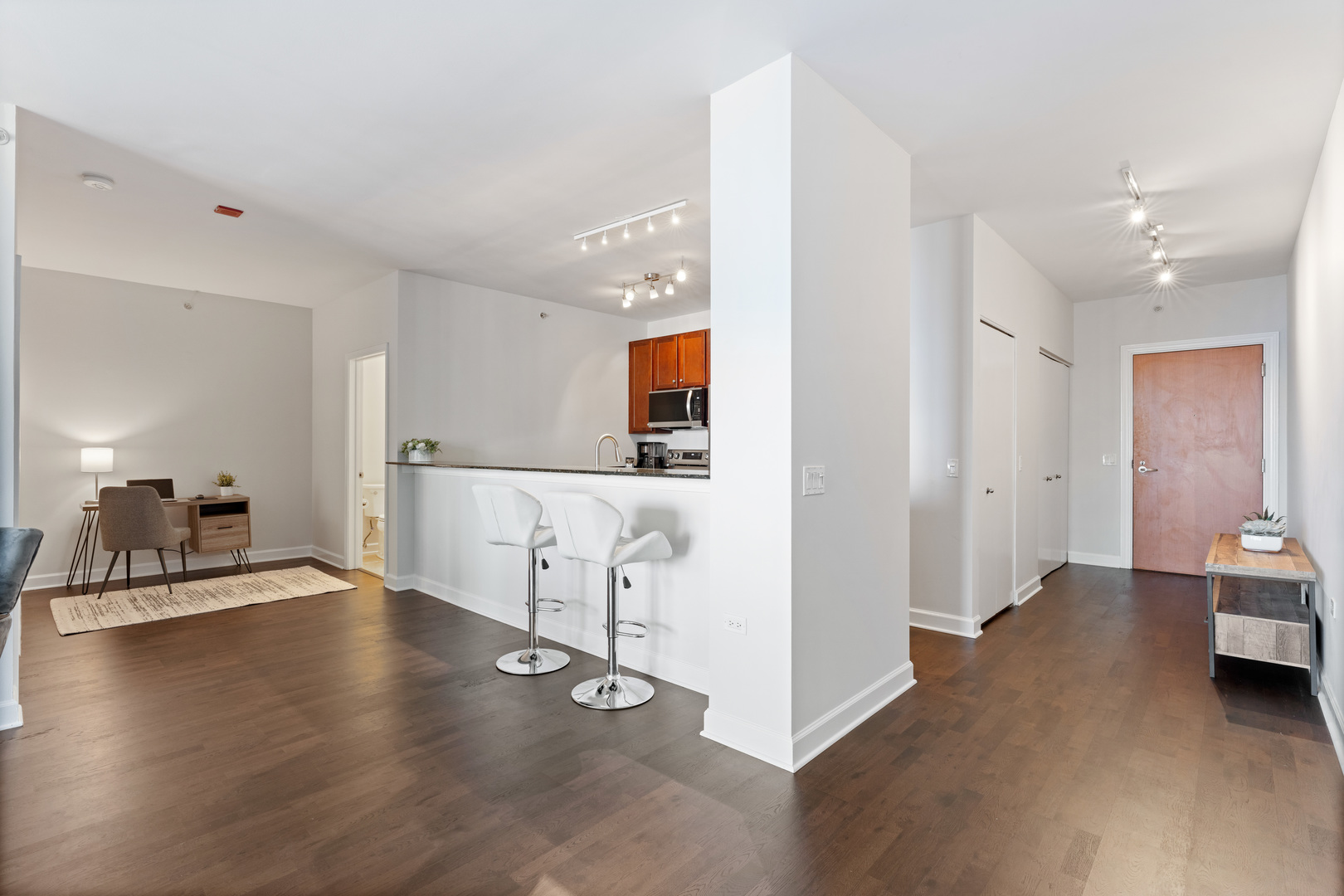 100 East 14th Street, Unit 1203 Chicago, IL 60605 - Photo 11 of 28 a view of a livingroom with furniture and an empty room