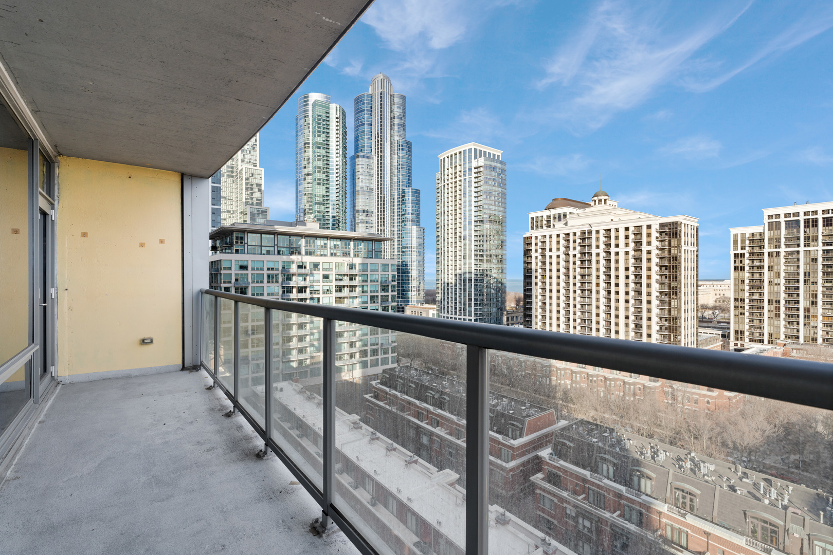 100 East 14th Street, Unit 1203 Chicago, IL 60605 - Photo 21 of 28 a view of a balcony with furniture