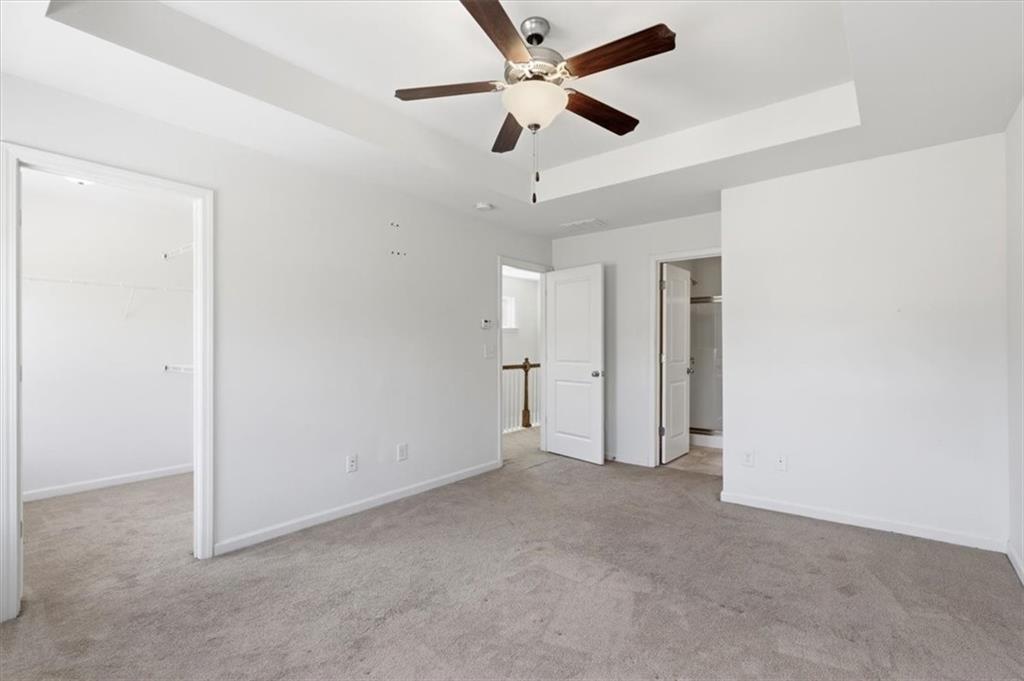 5064 Longview Walk Decatur, GA 30035 - Photo 21 of 30 an empty room with ceiling fan and window