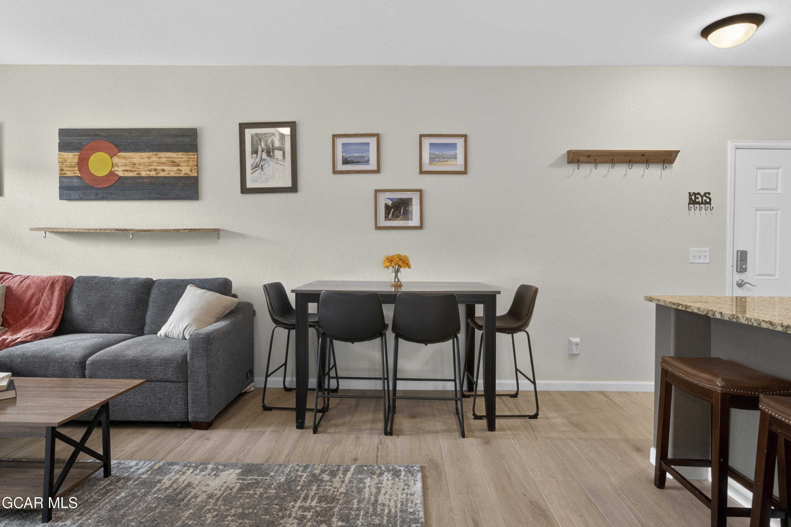 158 Village Road Granby, CO 80446 - Photo 11 of 46 a living room with furniture and a wooden floor