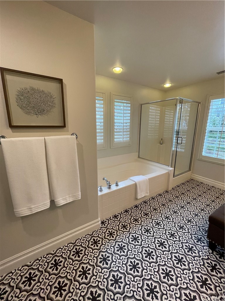 21 Kelfield Drive Ladera Ranch, CA 92694 - Photo 12 of 18 a bathroom with a bathtub and a shower