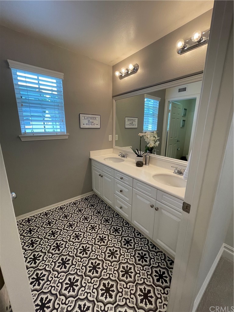 21 Kelfield Drive Ladera Ranch, CA 92694 - Photo 15 of 18 a bathroom with a sink a vanity and a mirror