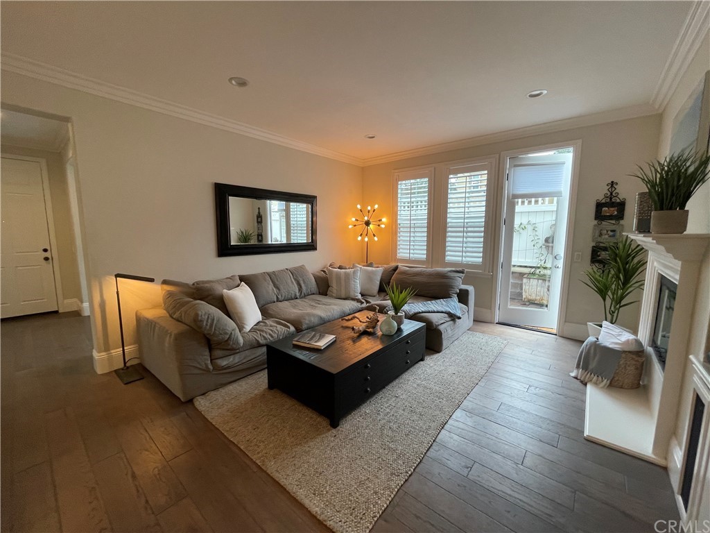 21 Kelfield Drive Ladera Ranch, CA 92694 - Photo 6 of 18 a living room with furniture fireplace and a large window