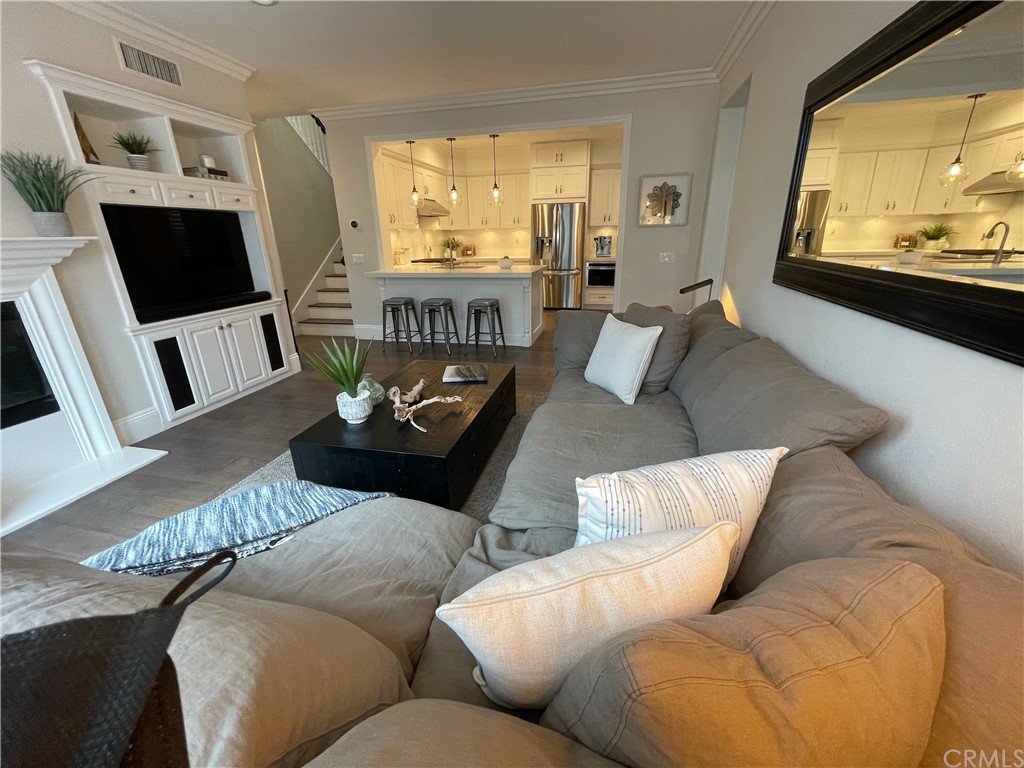 21 Kelfield Drive Ladera Ranch, CA 92694 - Photo 7 of 18 a living room with furniture and a large window