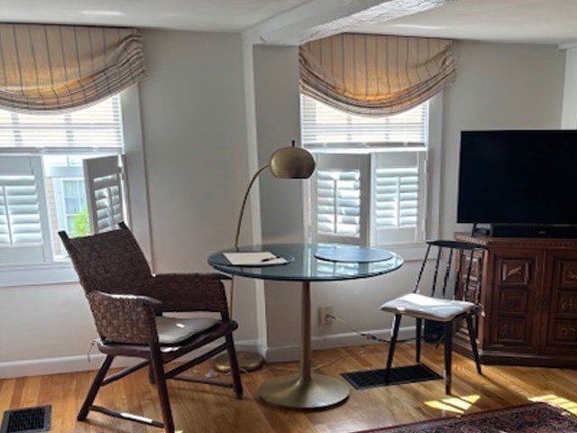 7 Lee Street, Unit 1 Marblehead, MA 01945 - Photo 12 of 32 a living room with furniture and a flat screen tv