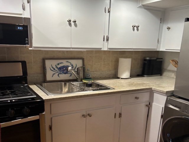 7 Lee Street, Unit 1 Marblehead, MA 01945 - Photo 15 of 32 a kitchen with a sink and a stove top oven