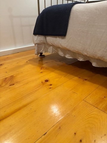 7 Lee Street, Unit 1 Marblehead, MA 01945 - Photo 19 of 32 a blue sign sitting on top of a wooden floor