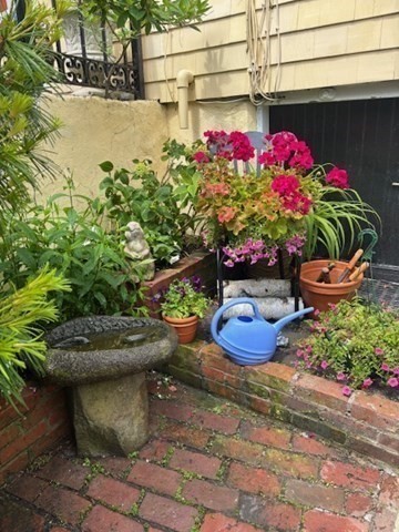 7 Lee Street, Unit 1 Marblehead, MA 01945 - Photo 27 of 32 a view of a backyard of the house