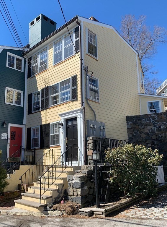 7 Lee Street, Unit 1 Marblehead, MA 01945 - Photo 3 of 32 a front view of a building with street view