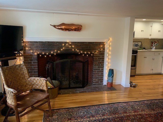 7 Lee Street, Unit 1 Marblehead, MA 01945 - Photo 10 of 32 a view of a living room with furniture and a fireplace