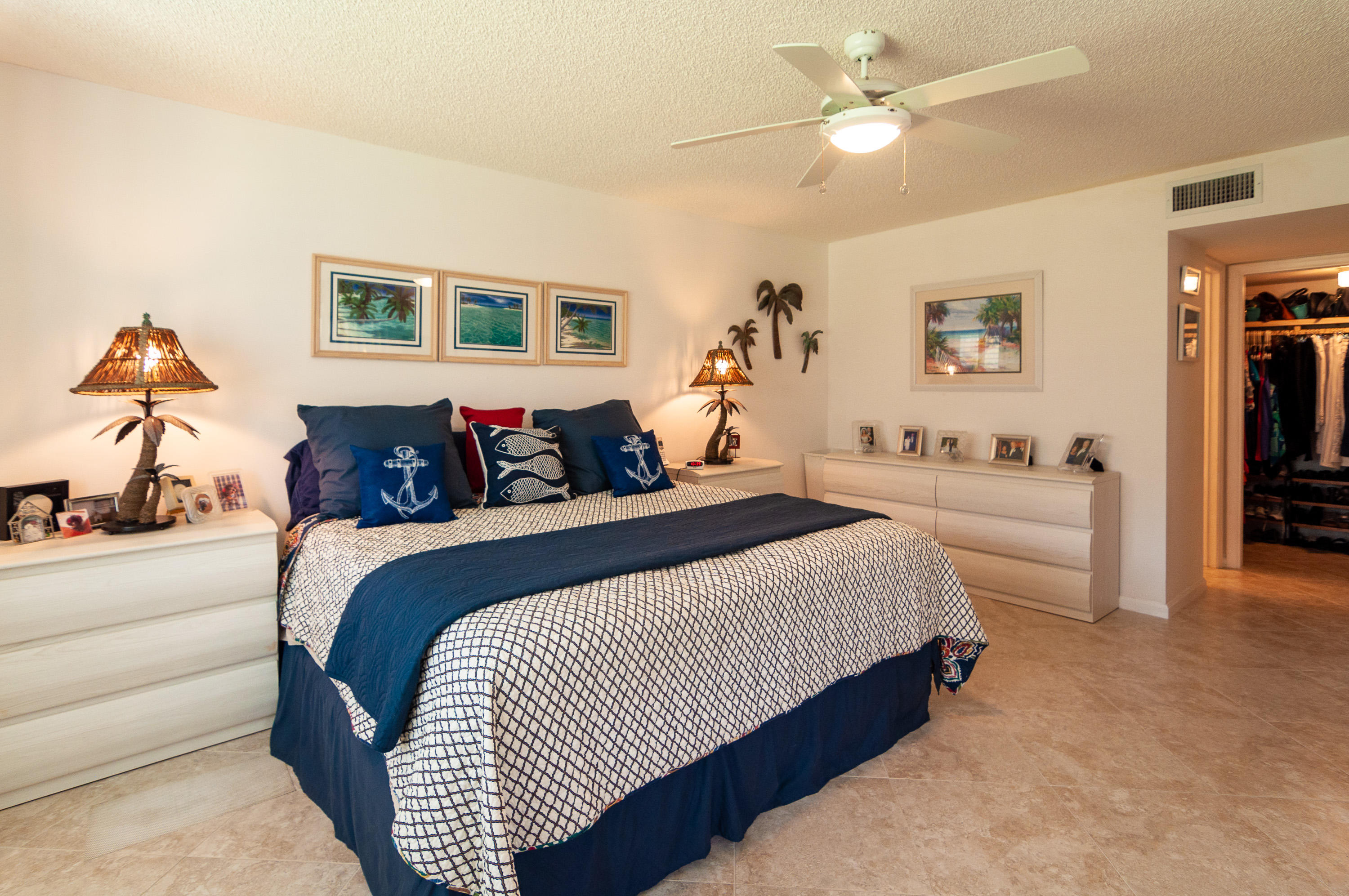 4161 U.S. Highway 1, Unit E2 Jupiter, FL 33477 - Photo 14 of 37 a bedroom with bed and window