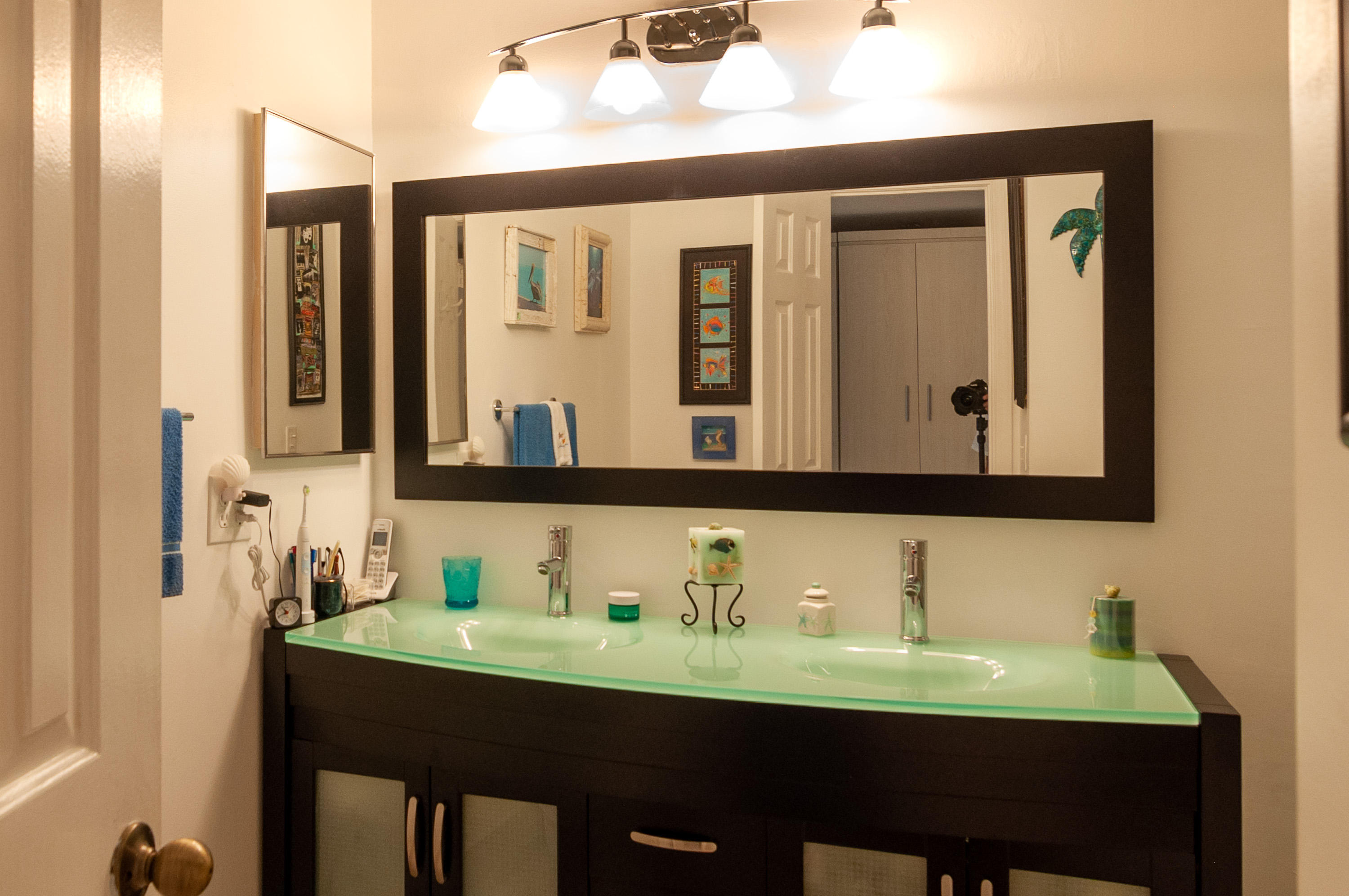 4161 U.S. Highway 1, Unit E2 Jupiter, FL 33477 - Photo 19 of 37 a bathroom with a sink and a mirror