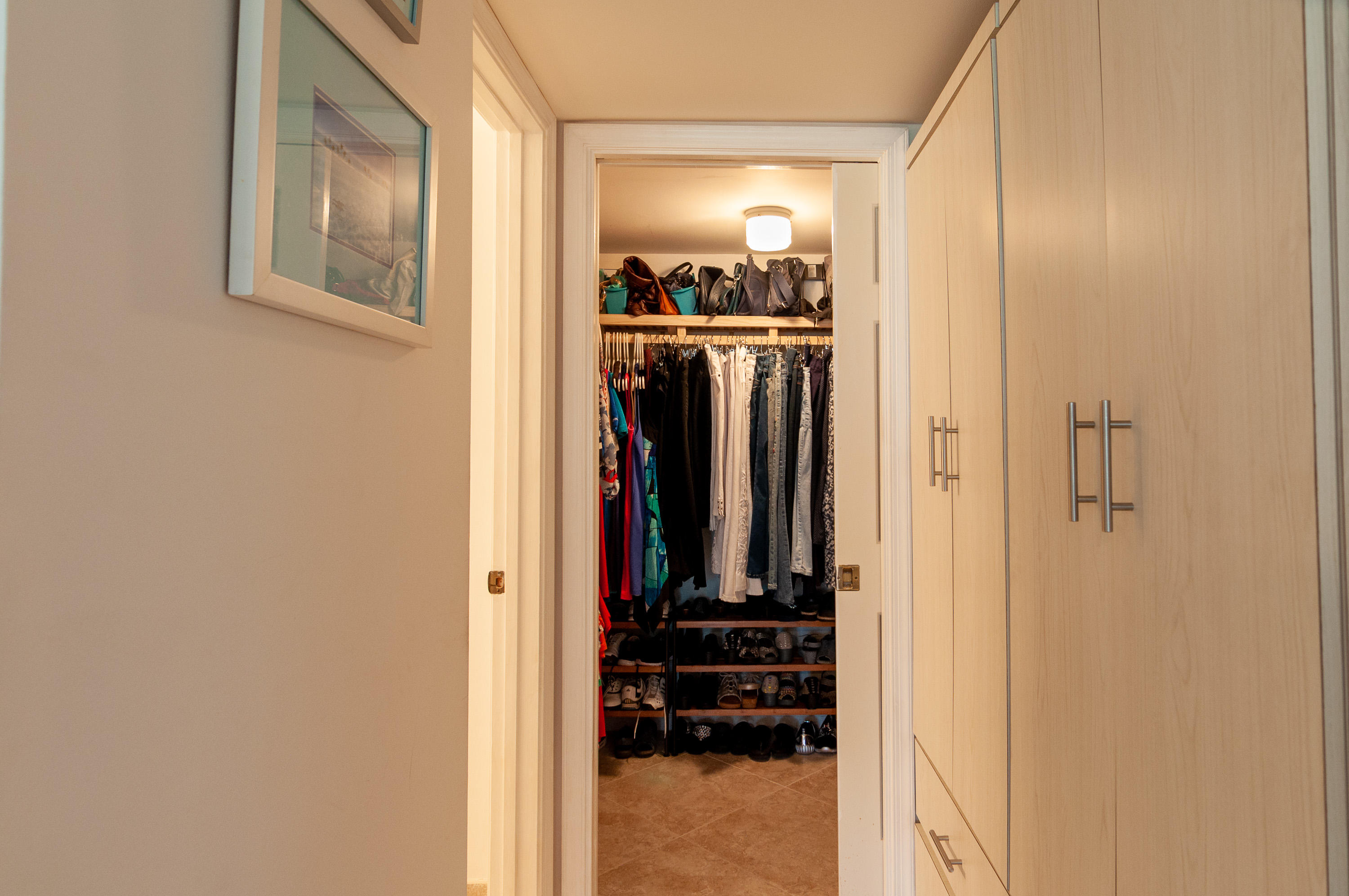 4161 U.S. Highway 1, Unit E2 Jupiter, FL 33477 - Photo 20 of 37 a view of a hallway with closet and a window