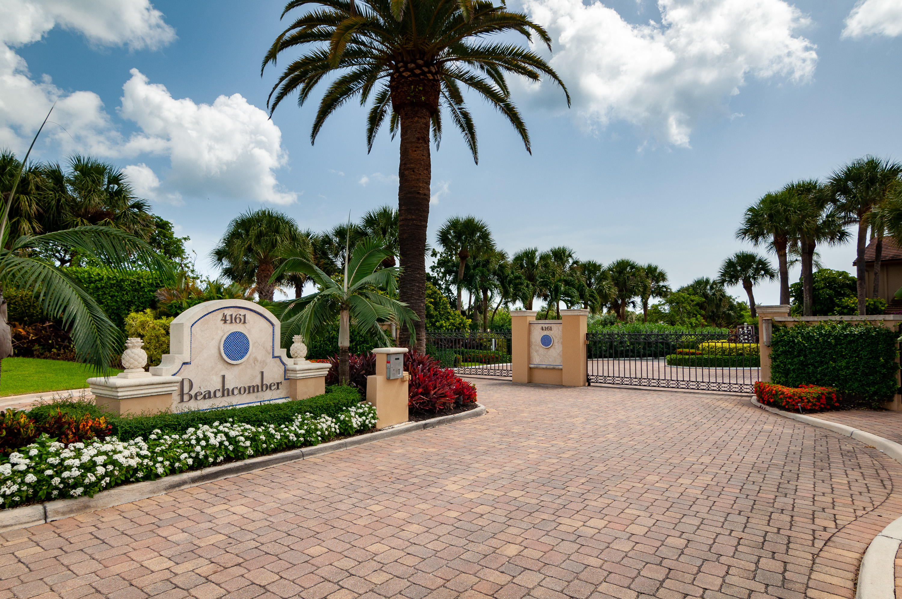 4161 U.S. Highway 1, Unit E2 Jupiter, FL 33477 - Photo 2 of 37 a park view with a fountain and a garden