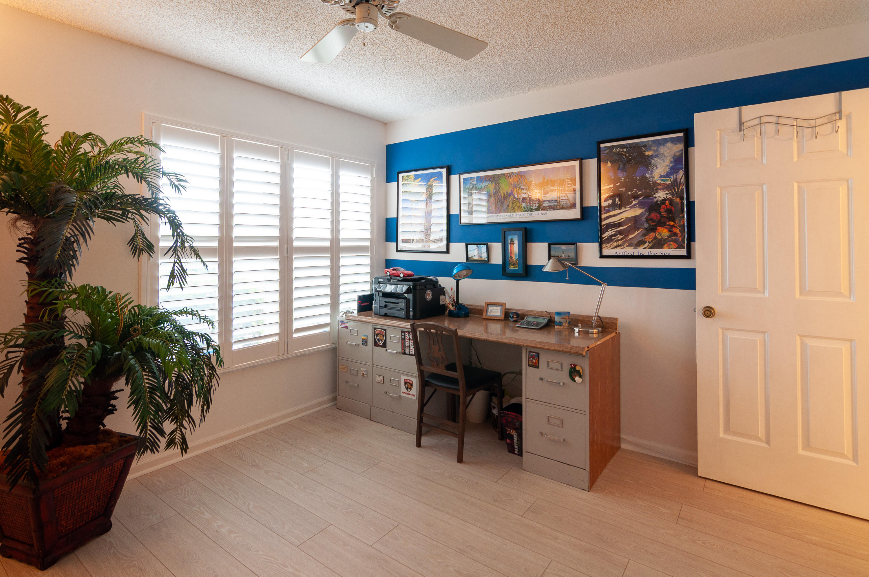 4161 U.S. Highway 1, Unit E2 Jupiter, FL 33477 - Photo 25 of 37 a view of a workspace with furniture and a window