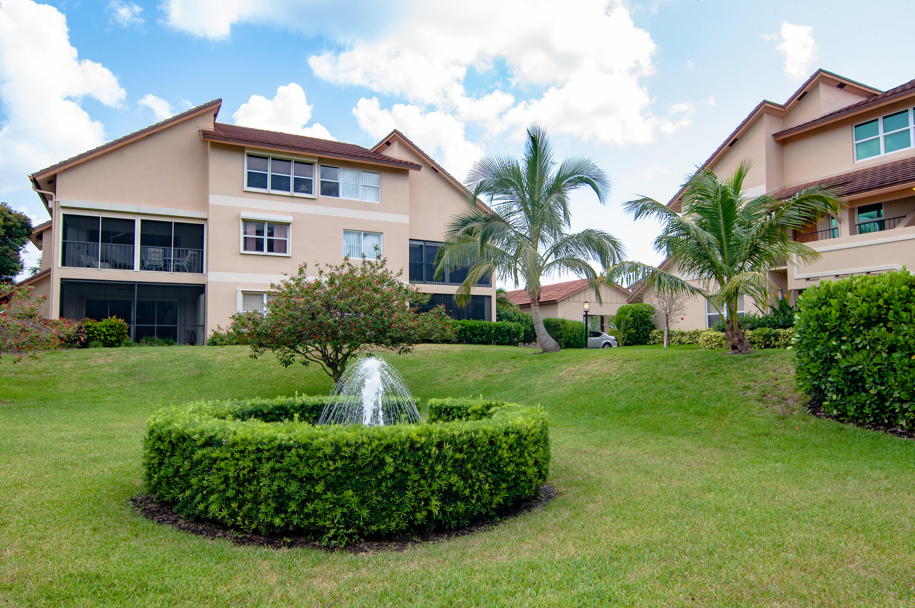 4161 U.S. Highway 1, Unit E2 Jupiter, FL 33477 - Photo 35 of 37 a front view of a house with a yard