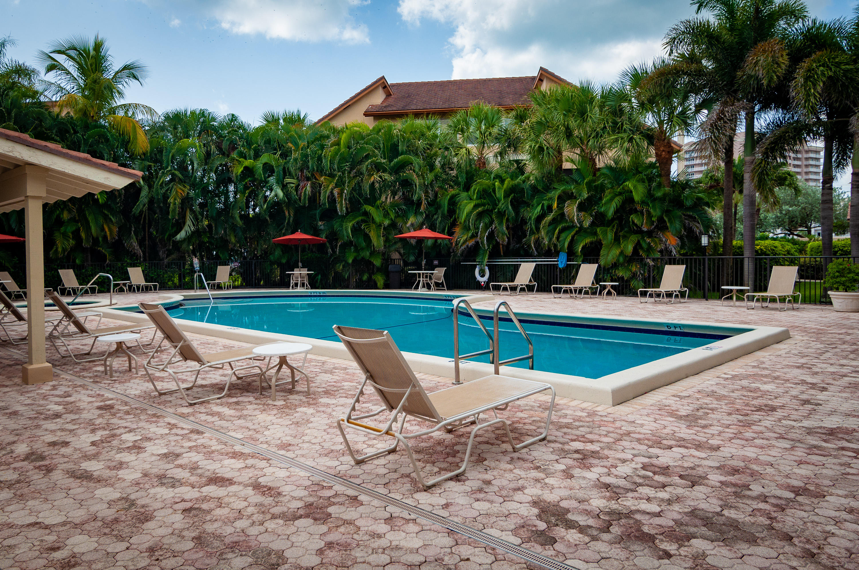 4161 U.S. Highway 1, Unit E2 Jupiter, FL 33477 - Photo 37 of 37 a view of a swimming pool with sitting area and slide