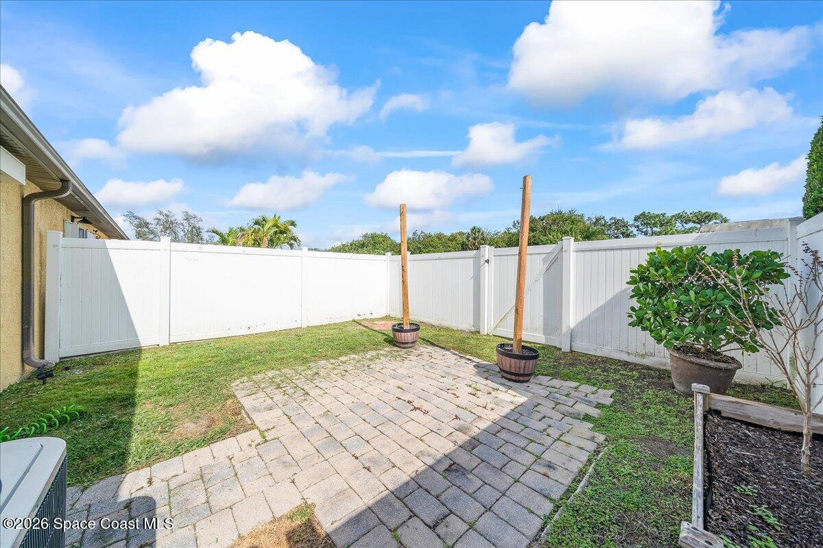 870 Luminary Circle, Unit 103 Melbourne, FL 32901 - Photo 16 of 23 a view of a backyard