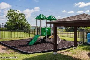 870 Luminary Circle, Unit 103 Melbourne, FL 32901 - Photo 22 of 23 a view of a backyard with a garden and plants