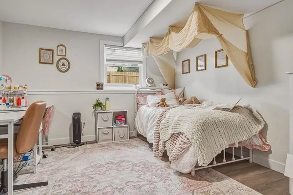 a bedroom with a bed and a table