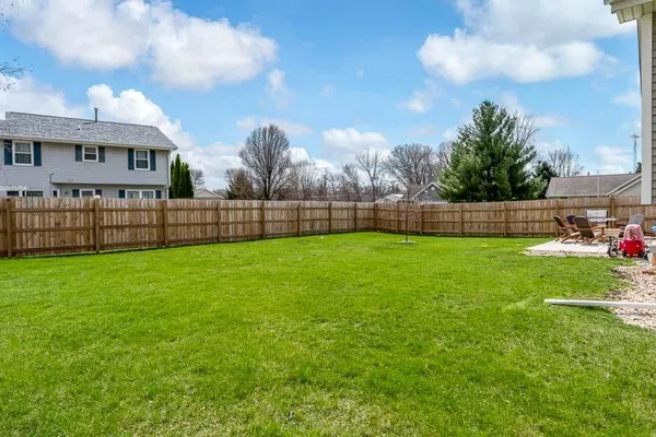 a view of a yard in front of a house