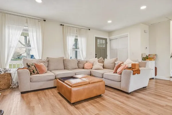 a living room with furniture and a large window